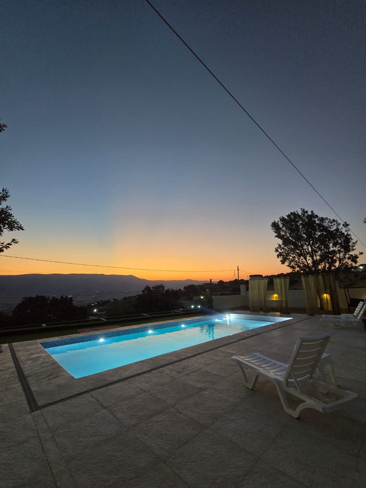 Mountain Breeze pool overlooking the mountains at sunset